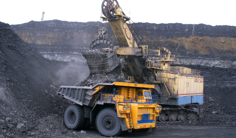 Mining operations with heavy machinery and excavators